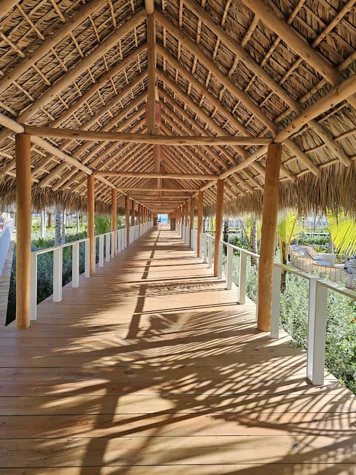 Boardwalk walkway at W Punta Cana connecting guest rooms, restaurants, and pool areas